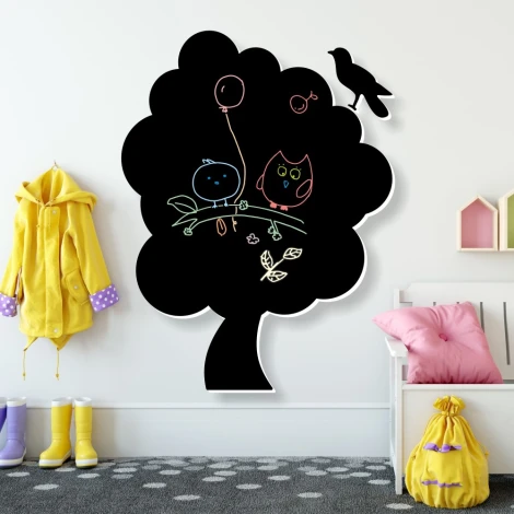 Chalkboard tree 122 - Decorated children\'s room with light-colored walls and a polka dot rug on the floor.
