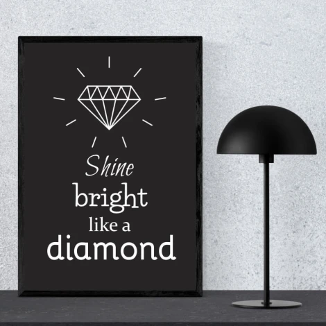 Shine Bright Like a Diamond 002 poster - Styled in a room with a light-colored wall and a black lamp beside it.