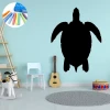 Chalk sticker for kids - turtle design in a bright nursery with wooden furniture and a rug.