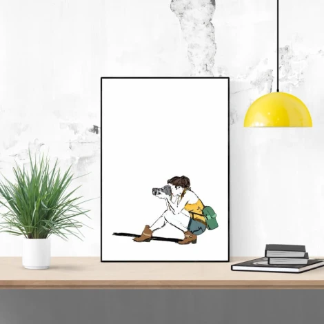 Photographic poster 188 - Graphic design. Sitting figure with a camera on a white background, green backpack, and yellow lamp.