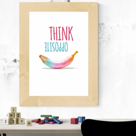 Think Opposite poster 150 - Graphic design with pink and blue text above a banana in pastel shades.