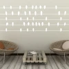 Bird wall sticker 2484 - Living room decor with light-colored walls and natural-toned furniture.