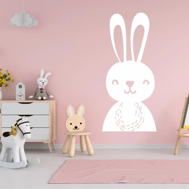 Wall sticker for kids featuring a bunny, perfect for a pink-themed nursery with light furniture.