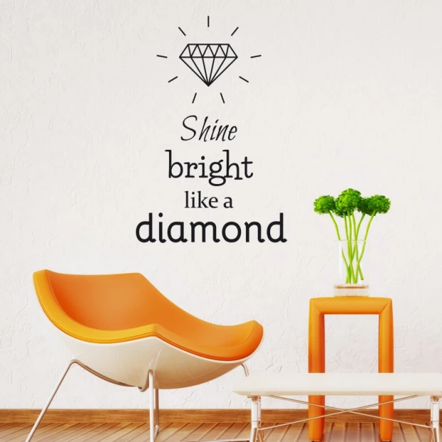 Wall sticker "shine bright like a diamond" 2496 - Living room decor with light walls and an orange chair.