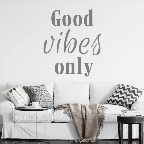 Good vibes only decorative sticker 2510 - Living room setup with light walls, bright sofa, and patterned cushions.