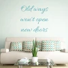 Wall sticker "Old ways won\'t open new doors" 2504 - Living room decor. Light-colored walls, sofa with cushions.