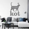 Wall template "Here rules the cat" 2511 - Living room decor with light walls, minimalist furniture, and accessories.