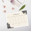 Magnetic dry-erase board Weekly planner 468 - Graphic design with a light background and subtle palm leaves in the corners.