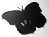 Butterfly-shaped chalkboard with clear wings, includes pastel chalk.