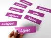 Custom printed magnet - Graphic design. Rectangular purple labels with white text.