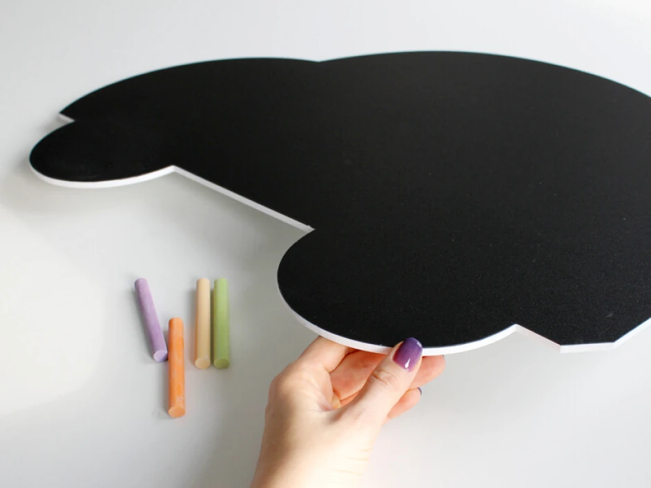 Chalkboard magnetic board for kids shaped like a car with rounded edges.