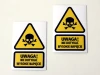 High Voltage Do Not Touch Sticker - Graphic design with a skull and bones, triangular shape, yellow background, black text.