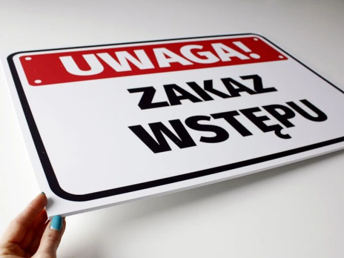 Warning: No Entry Sign - Rectangular sign with a red background and large black letters.