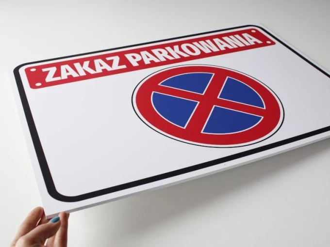 No Parking Sign T039 - Rectangular sign with red text and blue symbol.