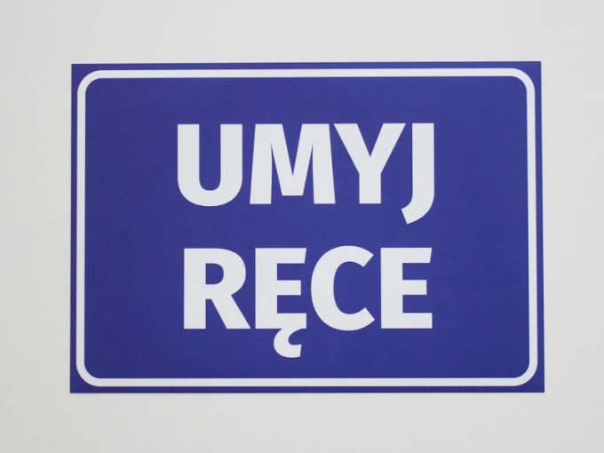 Handwashing Sticker - Graphic Design. White, large letters on a blue background reading WASH YOUR HANDS.