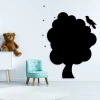 Magnetic chalkboard for kids shaped like a tree, perfect for bright children\'s rooms with plush toys nearby.