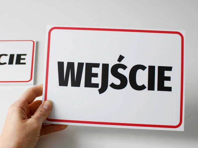 Entrance sign T046 - Graphic design. Simple rectangular sign with a white background and red border. Large text.