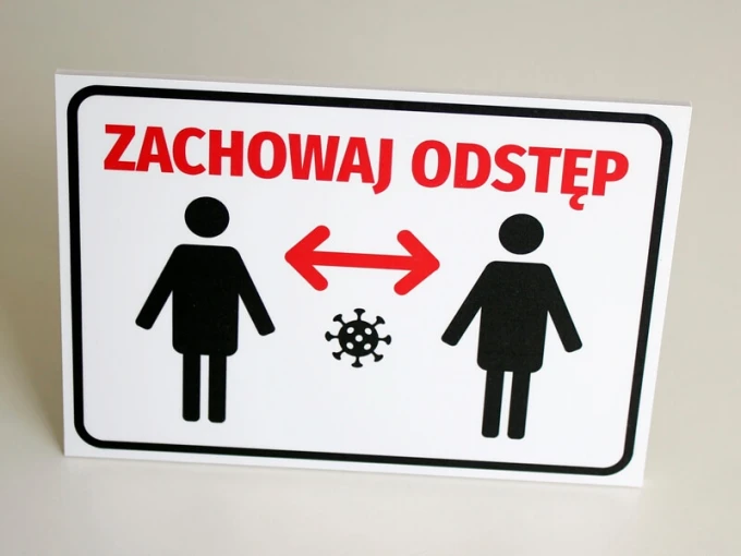Sign T413 Keep Distance - Graphic design featuring two human figures with a virus symbol between them.