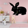 Chalkboard magnetic board for kids featuring a rabbit design, perfect for a pink-themed nursery with light furniture.