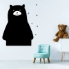 Chalkboard magnetic board bear 295 - Decor in a child\'s room with light-colored walls and a plush bear nearby.