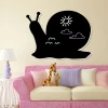 Chalkboard magnetic board snail 298 - Decorated in a child\'s room with light walls and pastel furniture.