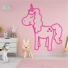 Unicorn wall sticker for kids 2545 - Decorates a child\'s room with pink walls and light-colored furniture.