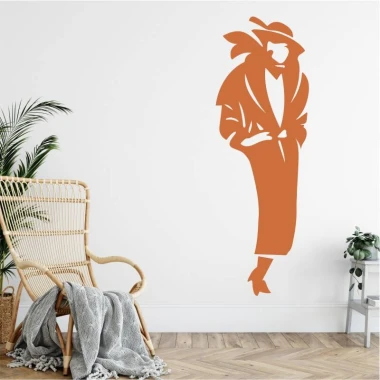 Wall sticker of a female silhouette 2531 - Designed for a bright living room with wooden flooring and greenery in the background.