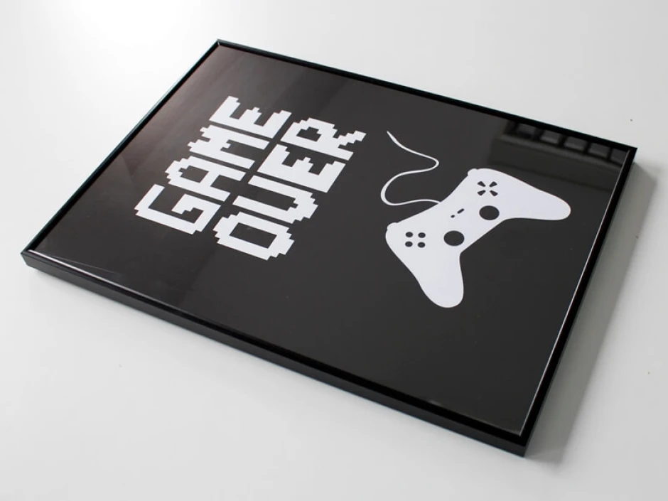 Game Over 001 poster - Graphic design featuring white GAME OVER text and a pixel-style controller on a black background.