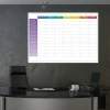 Magnetic dry-erase weekly planner board with hours - Office arrangement. Dark-colored walls.