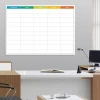 Magnetic dry-erase weekly planner board - Office setup with light-colored walls and furniture.
