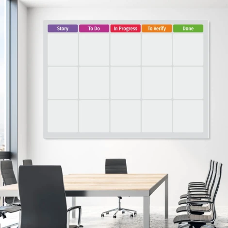Magnetic whiteboard for scrum tasks, ideal for office setup with light walls and stylish furniture.