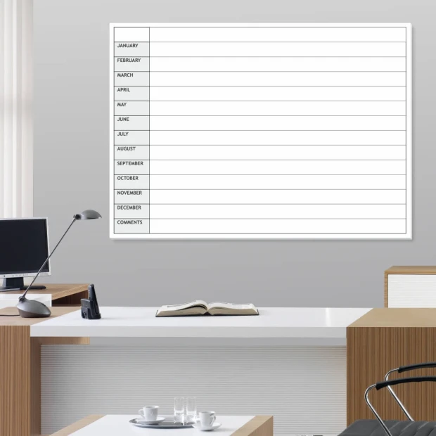 Annual planner whiteboard en 010 - Office setup with light-colored walls and brown furniture.