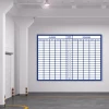Magnetic whiteboard for loading and unloading, ideal for warehouse organization. White walls and gray floor.