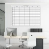 Dry-erase board 086 - Office setup with light walls and minimalist furniture in shades of white and gray.