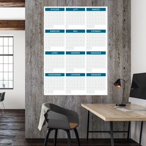 Universal yearly dry-erase calendar 352 - Office setup with gray-beige walls and wooden accents.