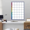 Weekly planner dry-erase board 277 - Office setup with light-colored walls and brown furniture.