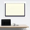 Whiteboard 01X 111 notebook - Office setup with light-colored walls and minimalist furniture.