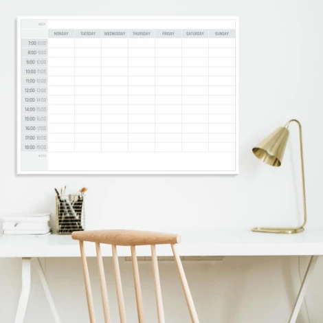 Weekly planner dry-erase board 295 English version - Office setup with light walls and minimalist furniture.
