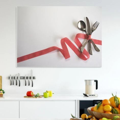 Dry-erase board with 209 cutlery pieces - Graphic design. Cutlery arranged on a white background, wrapped in a red ribbon.