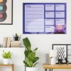 Blue weekly planner whiteboard with lotus flower design for modern office decor. Bright wall colors.