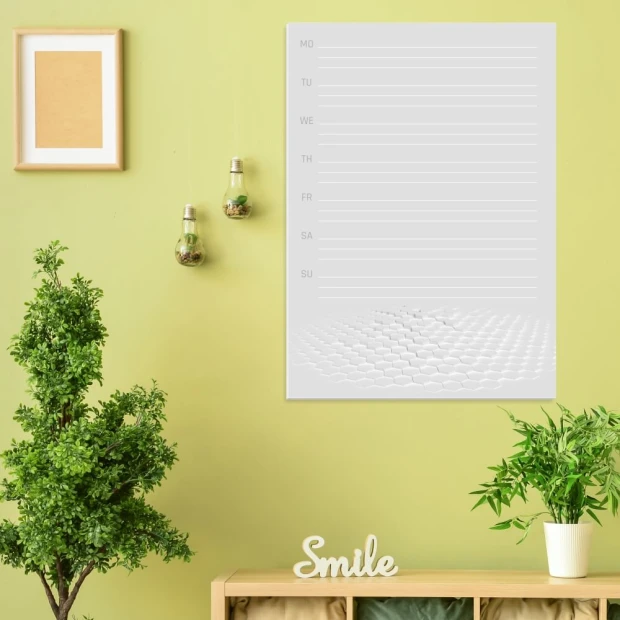 Weekly planner dry-erase board 425 - Office setup with light-colored walls and potted plants.
