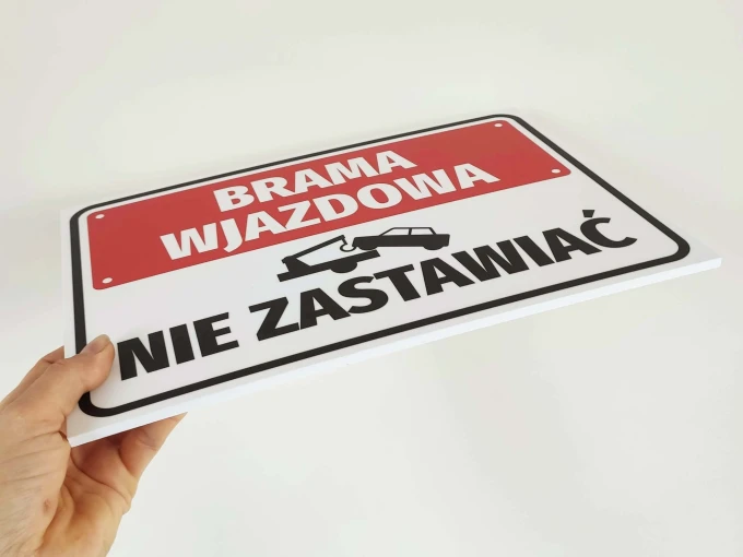 Entrance gate sign, do not block - Graphic design. Rectangular sign with red background, white text, and black details.