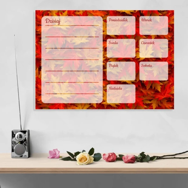 Weekly planner whiteboard with autumn leaves design. Colorful leaf background with text fields.