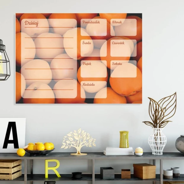 Weekly planner whiteboard in apricot color - Office setup with light walls, modern furniture, and plants.