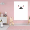 Dry-erase board for kids with a smiley face design, perfect for a pink-themed children\'s room with light furniture.