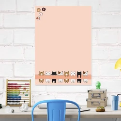 Dry-erase board for kids featuring cats, perfect for a bright children\'s room with pastel-colored furniture.
