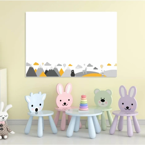 Dry-erase board for kids featuring animals and mountains, styled in a bright children\'s room with light walls and furniture.