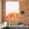 Magnetic dry-erase board in orange, styled in a kitchen with brick walls and modern furniture.
