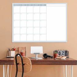 Weekly planner whiteboard 509 - Office setup with light walls, wooden desk, and minimalist furniture.