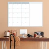 Weekly planner whiteboard 509 - Office setup with light walls, wooden desk, and minimalist furniture.